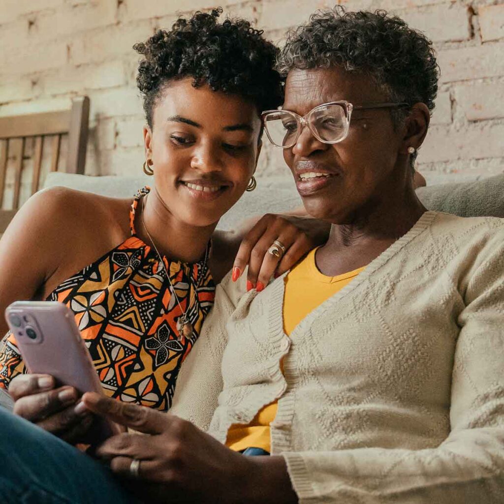 Mom with daughter on smartphone Mom with daughter on smartphone