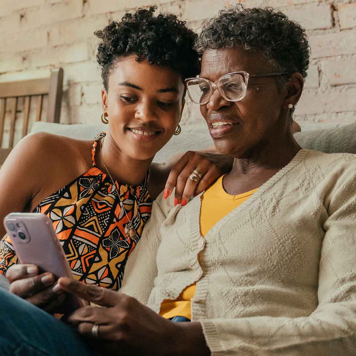 Mom with daughter on smartphone